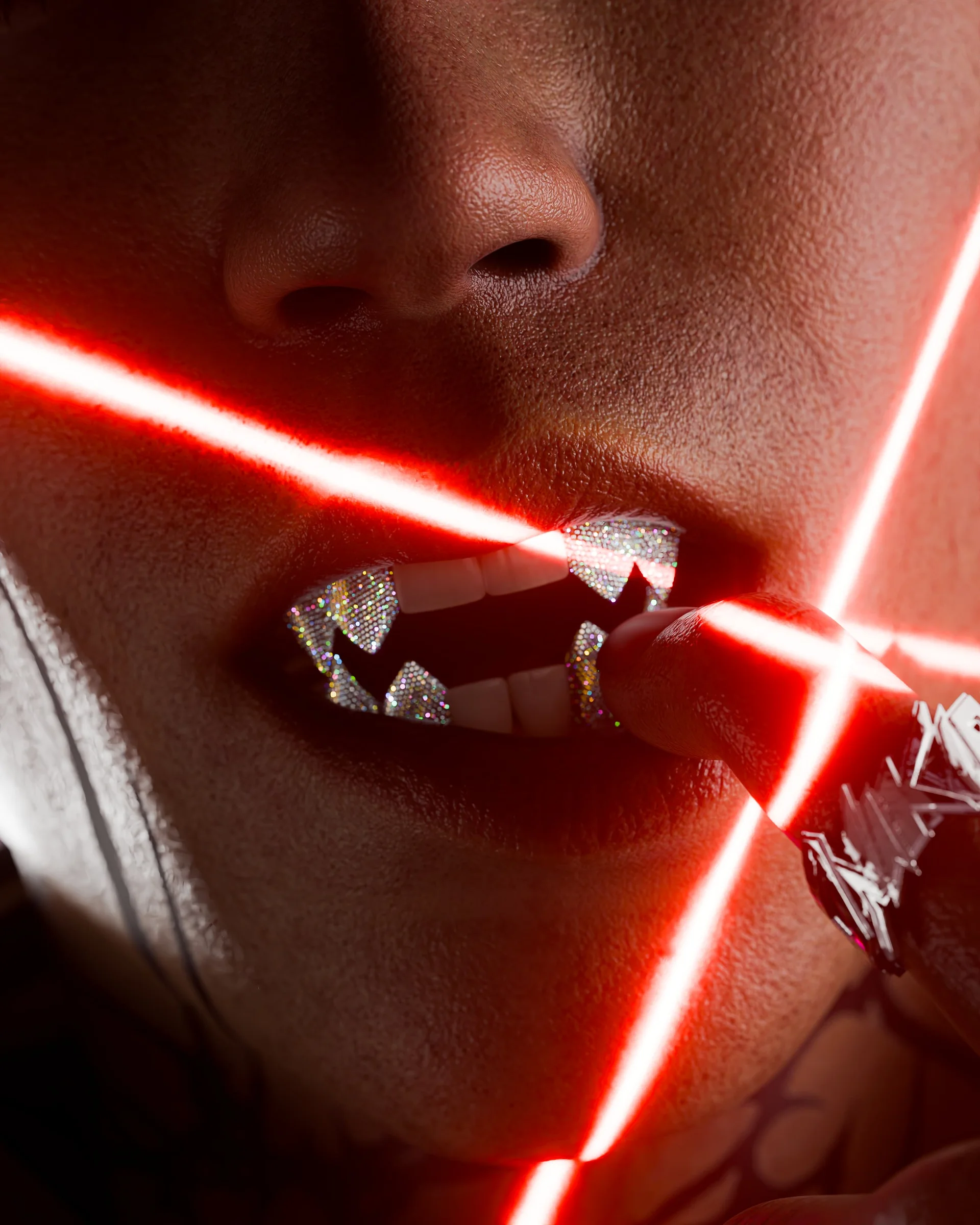 Reflective grillz intersected by red laser light